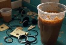 Latest Bose Wireless Earbuds: Is It Worth Buying? Messy kitchen counter with Bose earbuds, coffee spill