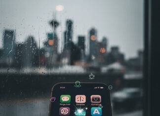 Hidden Gem Apps You Didn’t Know You Needed—Download Them Now! Phone screen with sparkling apps in a rainy Seattle coffee shop