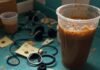 Latest Bose Wireless Earbuds: Is It Worth Buying? Messy kitchen counter with Bose earbuds, coffee spill