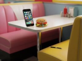 Top 10 Must-Have Apps in 2025 That Will Change Your Daily Life Diner booth, glowing phone, sad burger, chewed pen