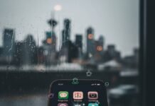 Hidden Gem Apps You Didn’t Know You Needed—Download Them Now! Phone screen with sparkling apps in a rainy Seattle coffee shop