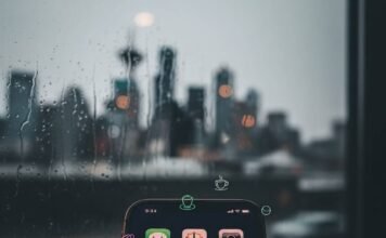 Hidden Gem Apps You Didn’t Know You Needed—Download Them Now! Phone screen with sparkling apps in a rainy Seattle coffee shop