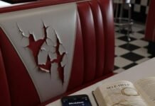 Best Apps for Mental Health and Wellness: Your Path to Calm in 2025 Diner booth, cracked seat, phone with mindfulness app, self-help book