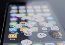 How to Choose the Right Apps for Your Smartphone: Expert Tips & Tricks Smudged phone screen with frowny face app icons