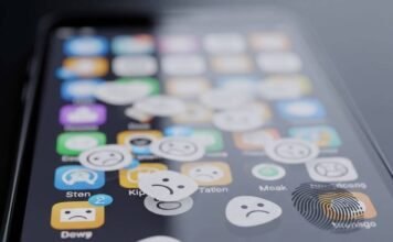 How to Choose the Right Apps for Your Smartphone: Expert Tips & Tricks Smudged phone screen with frowny face app icons